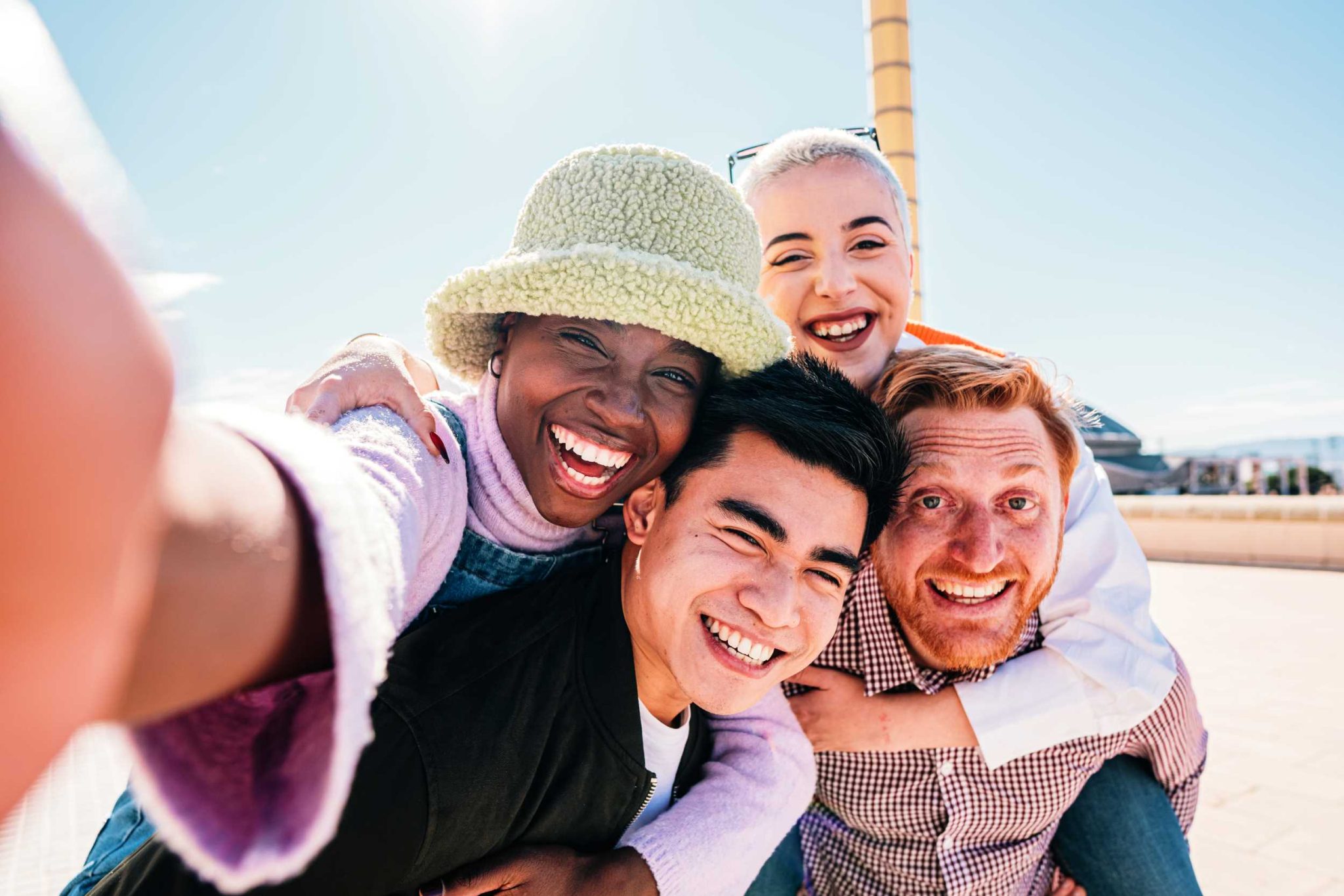 group-of-friends-giving-piggyback-ride-to-girlfrie-2023-11-27-05-31-45-utc-2048x1366